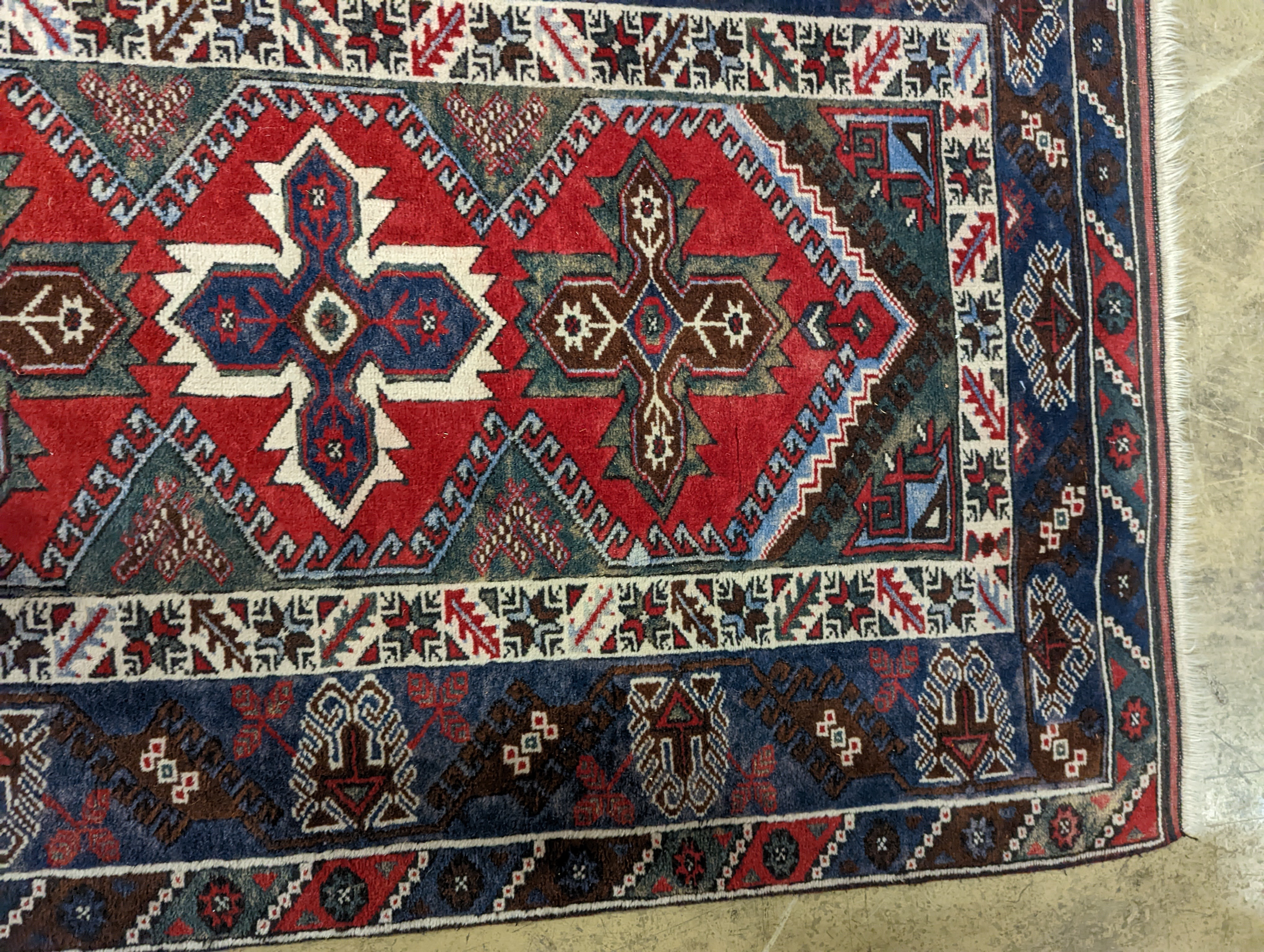 Two Turkish rugs and a Persian rugs. Largest, 284x172cm.